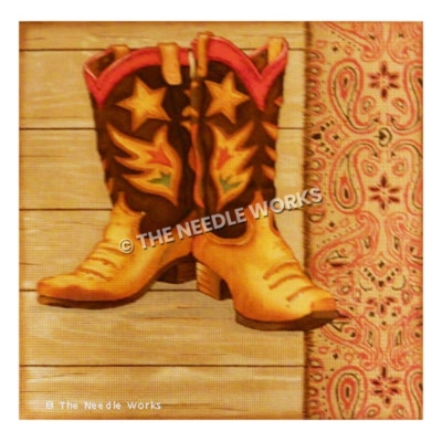 brown, orange and red boots decorated with star and red and green flowers on wooden floor background and paisley red patterned border