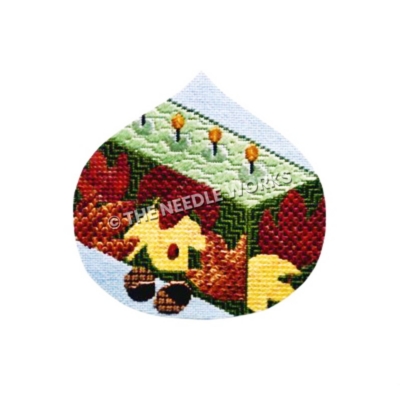 ornament with candles decorated in red and yellow leaves and acorns