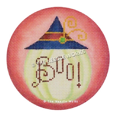 round pink ornament with white pumpkin with blue and red hat and BOO! written in red