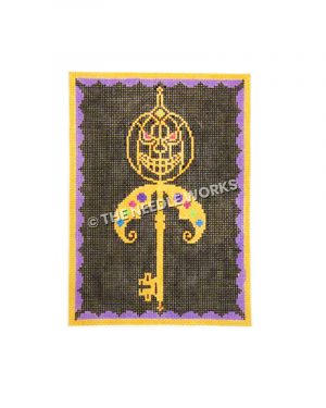 skeleton key on black background with yellow jackolantern