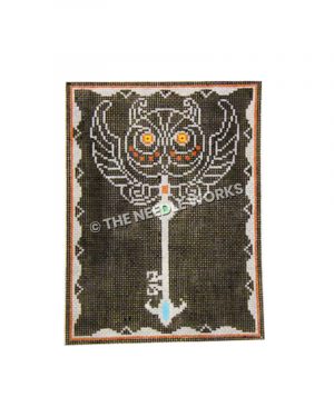 skeleton key on black background with white owl