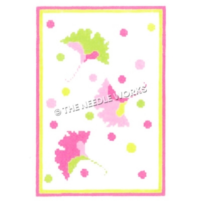 three falling leaves in yellow, pink and green with polka dots on white background and pink and yellow border
