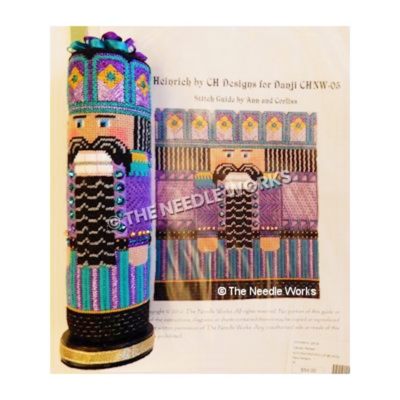 3D cylinder nutcracker in purple, turquoise, and gold suit with black hair and beard on gold base