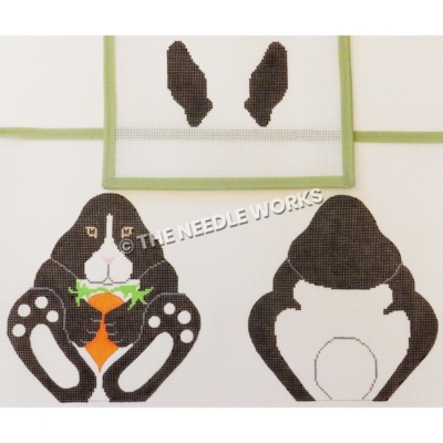 black and white bunny front and back sides holding a carrot with black ears separate