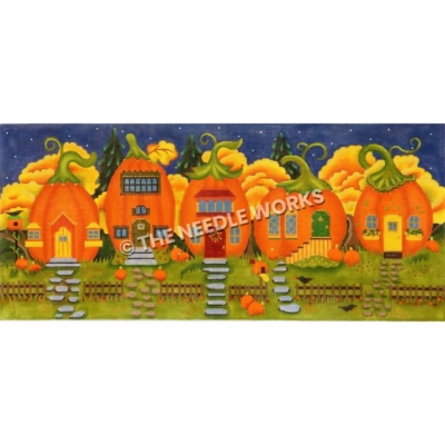 row of five pumpkin houses with yellow houses on dark blue sky with stars