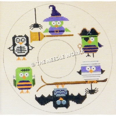 doughnut shape with green, black, purple owls in Halloween costumes