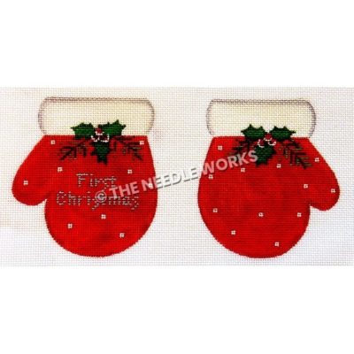 red gloves with white dots and trim and mistletoe with First Christmas written in silver on one