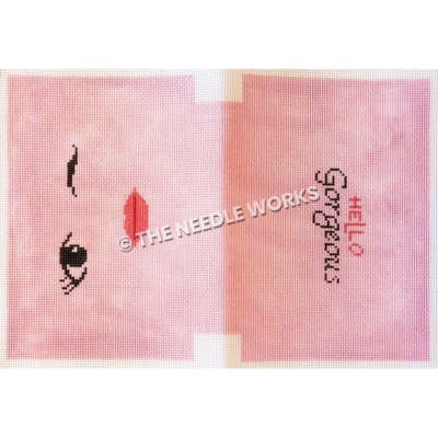 pink clutch with winking eye and pink lips on one side and Hello Gorgeous on other