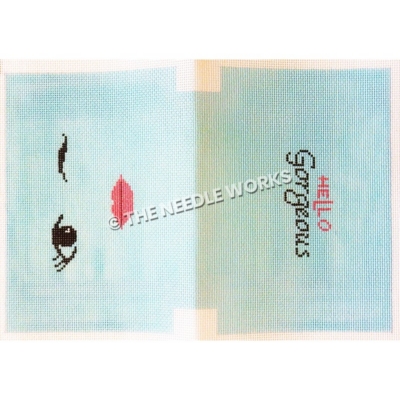 blue clutch with winking eye and pink lips on one side and Hello Gorgeous on other