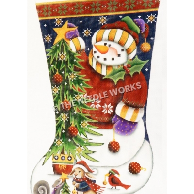 dark blue and white stocking with red and green trim showing snowman in red sweatshirt and yellow and white striped scarf placing star on top of Christmas tree and squirrel, rabbit, and redbird decorating a tree at the toe