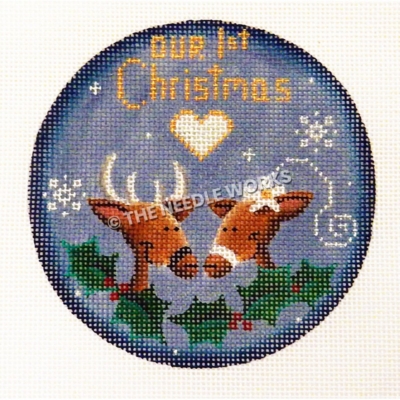 blue round ornament with two reindeers, one wearing white flower, with Our 1st Christmas in gold above with white heart and mistletoe at bottom