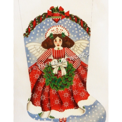 angel in red dress with white pattern holding wreath with white bow on blue and white background