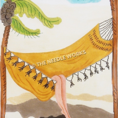 yellow hammock between two palm trees with legs sticking out
