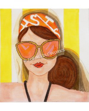 brunette closeup wearing orange and white head scarf with orange sunglasses in black swimsuit and yellow and white striped background