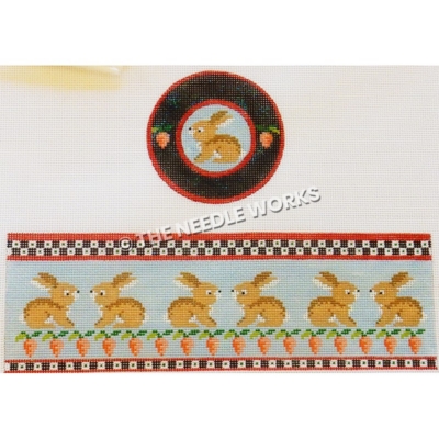 brown bunny on blue background with dark blue trim with pink flowers and stripe with brown bunnies, carrots and checkered pattern