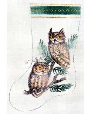 white stocking with two owls on pine branch and green and gold trim at top