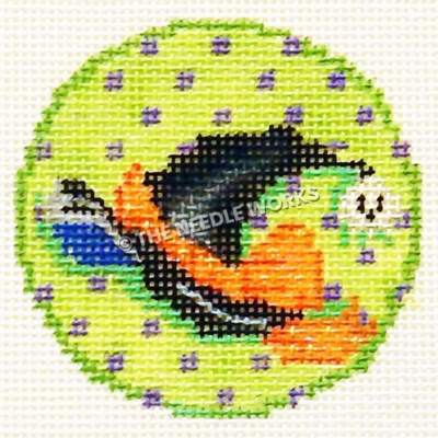 green ornament with purple polka dots and witch's hat, white skull, and orange sash