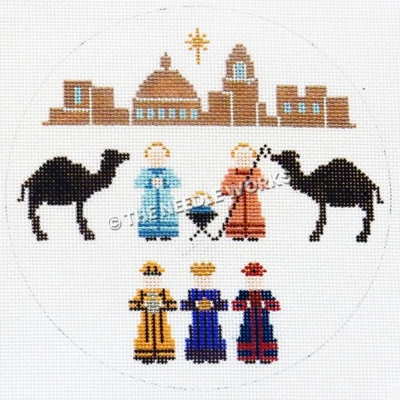 white ornament with nativity scene and town of Bethlehem and star above in background