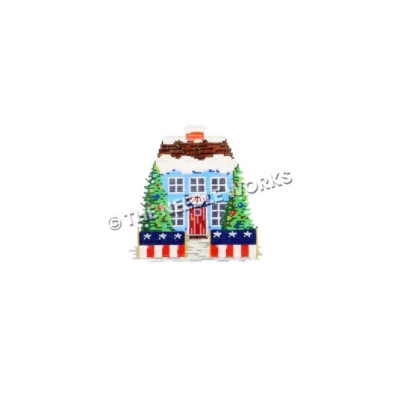 blue house snow-covered roof with patriotic decorations and Christmas trees in front