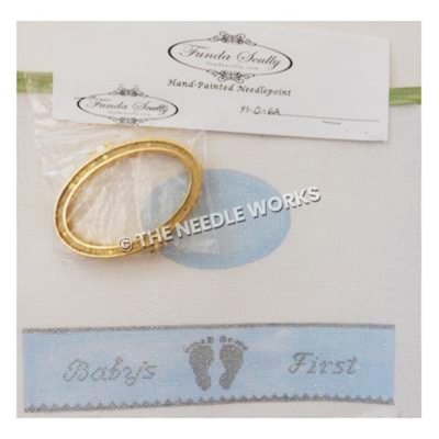 oval hinged box with blue top and Baby's First with footprints in gray around edge