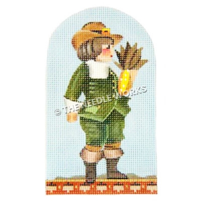 brunette pilgrim boy wearing green suit with brown boots carrying corn on blue background