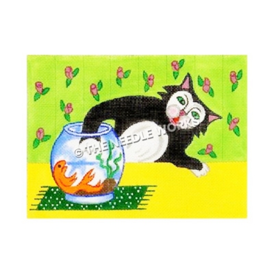 black and white cat reaching into goldfish bowl sitting on yellow table with green and pink flowered wallpaper in background