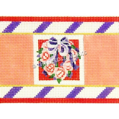 heart shaped wreath with pink flowers and purple and white ribbon with pink, purple, white, and red border