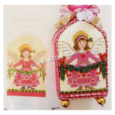 brunette angel in pink dress with red hearts carrying garland with red bows and hearts, trimmed in red, pink and yellow