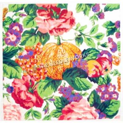 pumpkin surrounded by pink and purple flowers and peaches