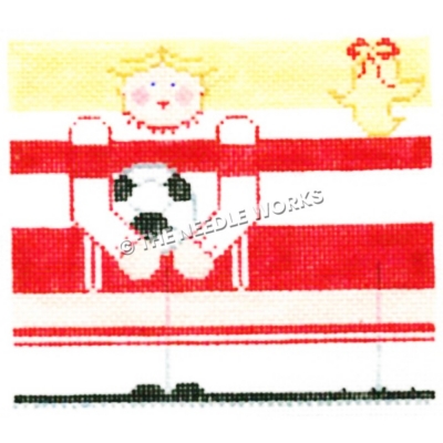 blonde soccer player in red and white uniform and gold bird with red bow in mouth