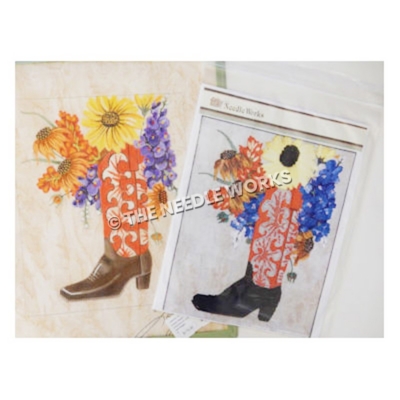 red, white and black boot filled with orange, yellow and purple flowers