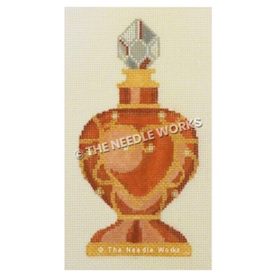 orange and gold purfume bottle with gold heart decoration