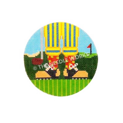 round ornament closeup of golfer's shoes