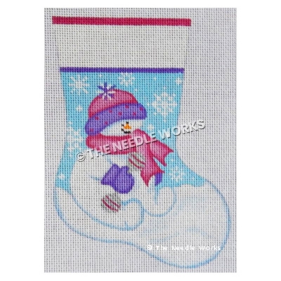 stocking with snowman sitting on snow with pink and purple hat and scarf with snowflakes on blue sky on background
