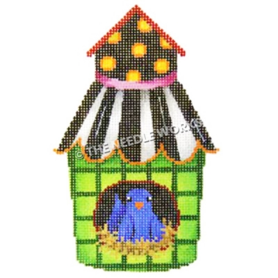 blue bird sitting in green birdhouse with black, white and gold polka dotted roof