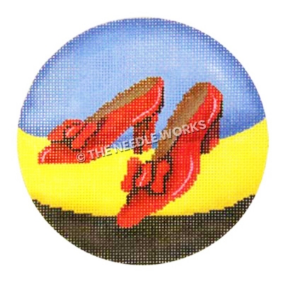 ornament with ruby red slippers on blue, yellow and black background