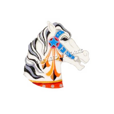 white carousel horse head with blue, silver, red and gold bridle