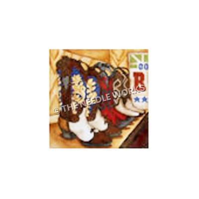 three cowboy boots lined up in a boot store