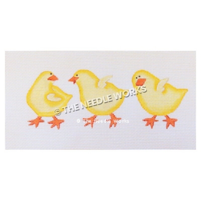 three yellow chicks walking