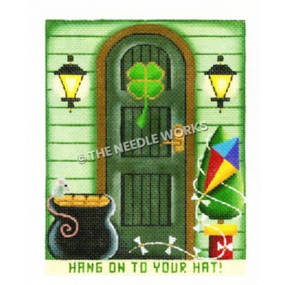 St. Patrick's Day themed house front with bag of gold and kite wrapped around tree beside door