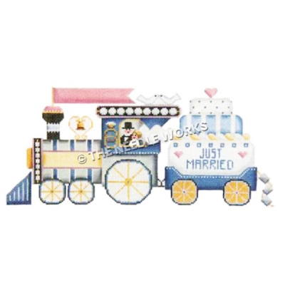 wedding train in blue, gold and white with couple in locomotive window hauling Just Married wedding cake