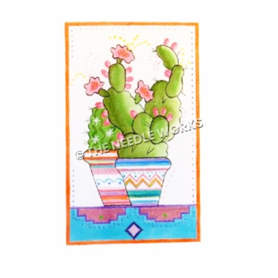 cactus with pink flowers in southwestern pattern pots