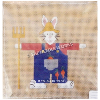 white farmer rabbit wearing blue overalls with carrots, yellow hat, and holding yellow pitchfork