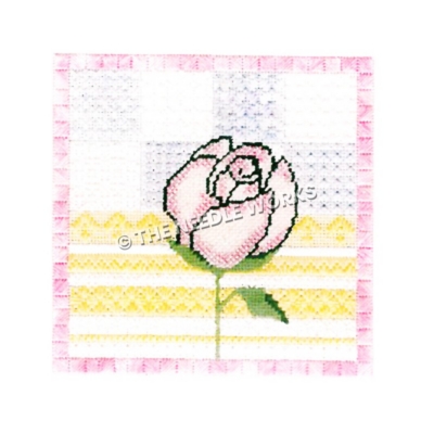 pink rose with yellow, purple, and white geometric pattern background with pink border