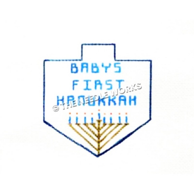 dreidel in blue outline with Baby's First Hanukkah written in blue with menorah