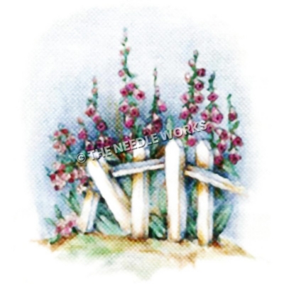 fox gloves behind white fence