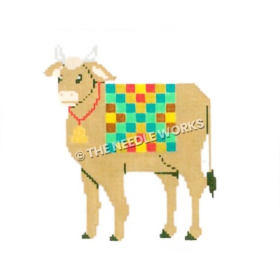 brown cow wearing bell and multi-color checkered blanket