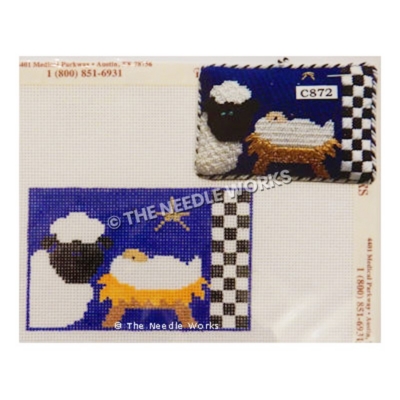 nativity scene with black sheep and baby in manger