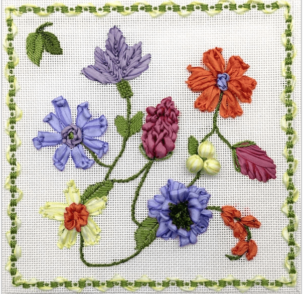 purple, pink, white and orange flowers with 3D decorative stitches on white background and green and white vine and ribbon border