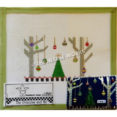green Christmas tree with two silver trees on each side and long hanging ornaments from silver trees